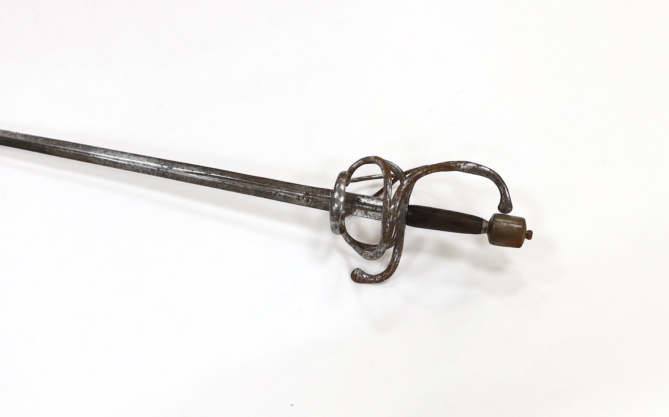 A swept hilt rapier, c.1620, blade fullered at the forte, iron guard of conventional form with later pommel and wooden grip, blade 113cm
